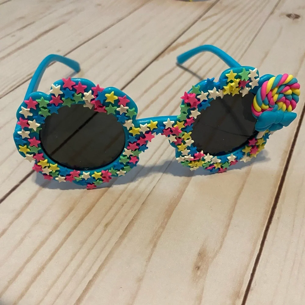 Girls electric blue flower shaped sunglasses